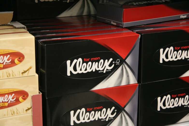 several different kinds of kleenex boxes stacked on top of each other