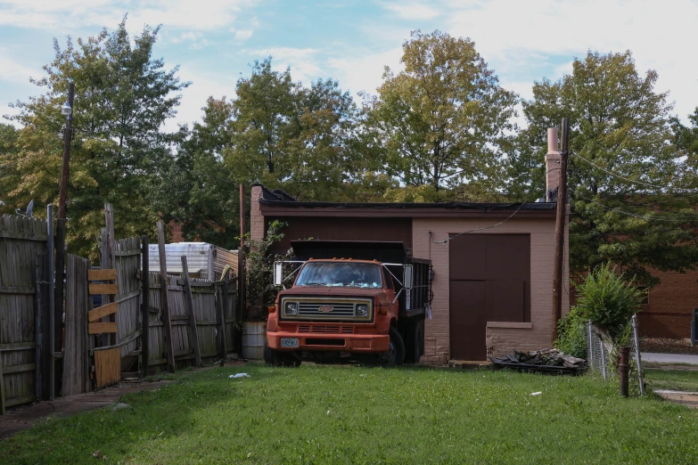 a red truck sitting in the back of a garage