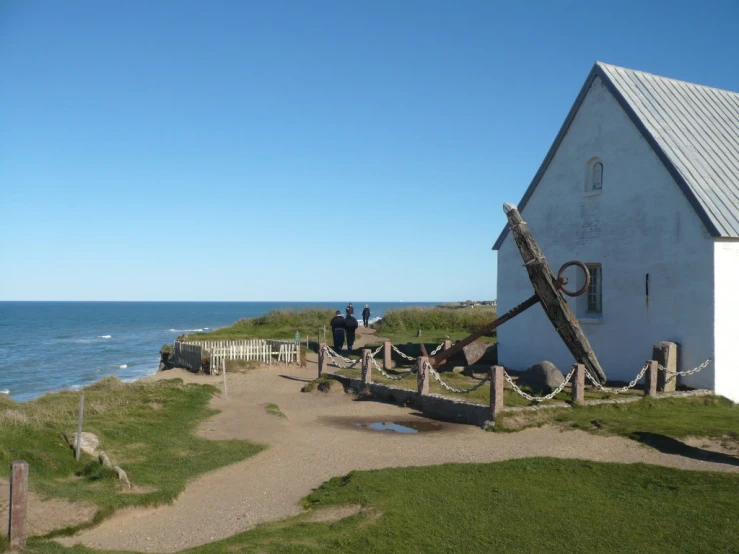 the old sailboat is parked at the beach