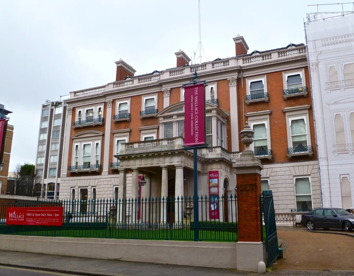 a large building on the corner of a street