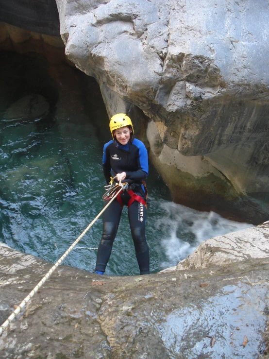 there is a female wearing a helmet and rope