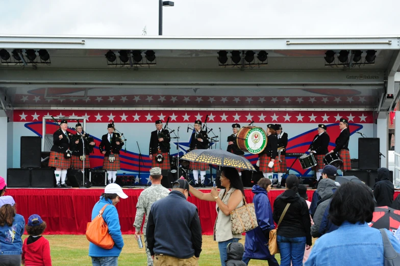 a large group of people are gathered at a festival