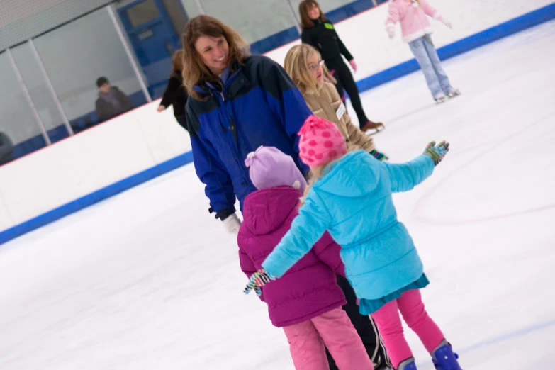 a few children that are on some ice skating
