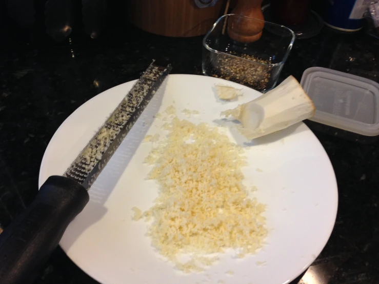 a knife and food is sitting on a plate