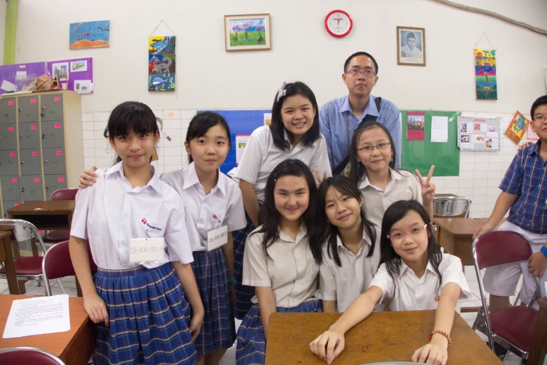 a group of young students posing for a po