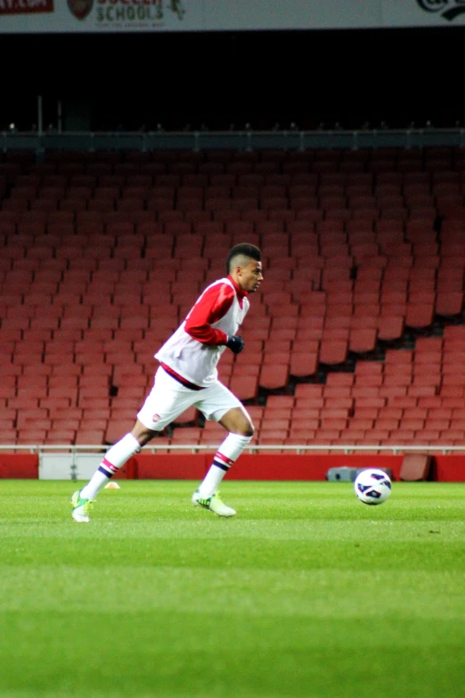 a person on a field playing soccer