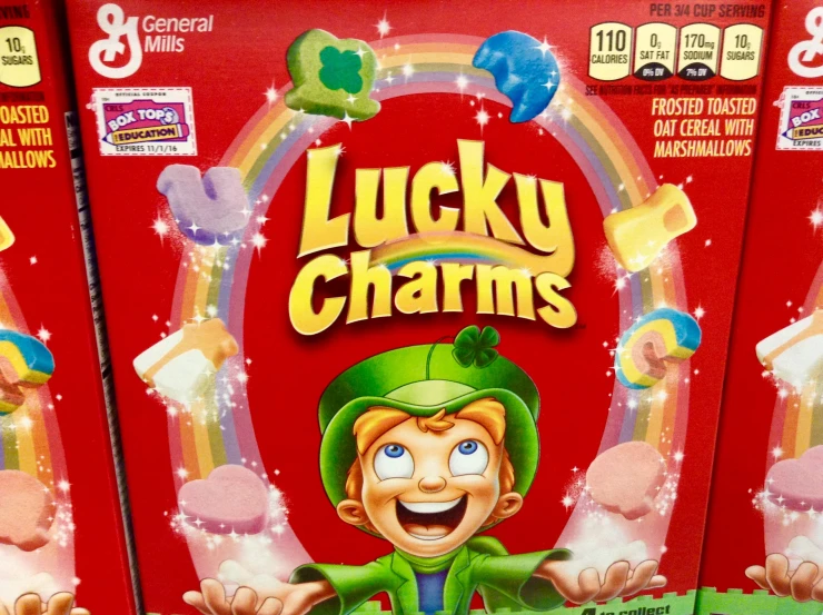 two boxes of lucky charms candy sitting in front of each other