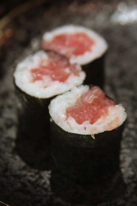 sushi rolls being prepared in an oriental kitchen