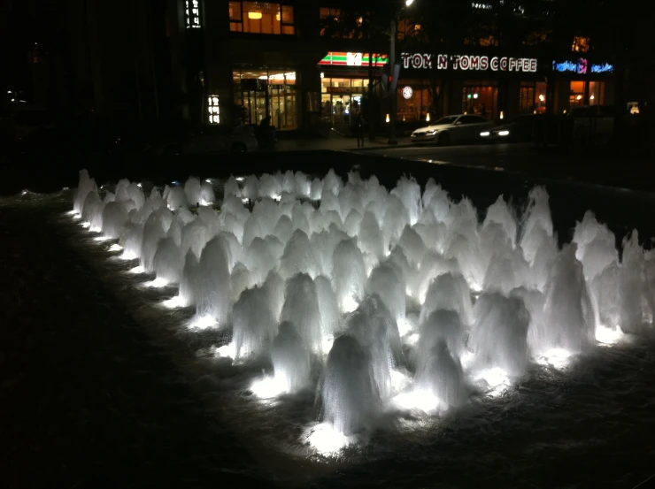 lighted water fountains lit up in a fountain