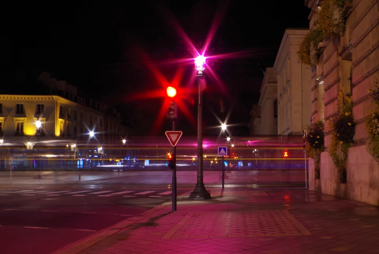 a street light on a red light with white lights