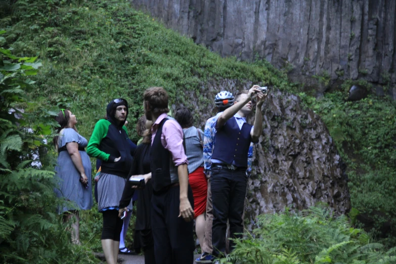 a group of people in the woods taking pos