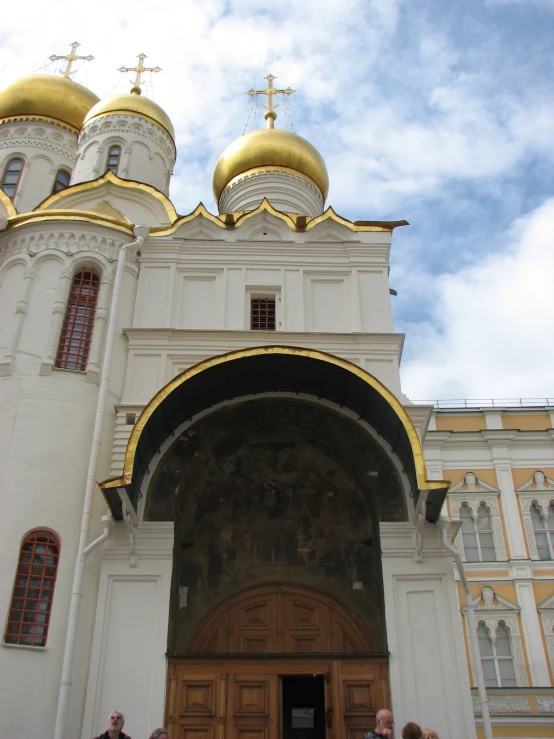 two people in front of an ornate church