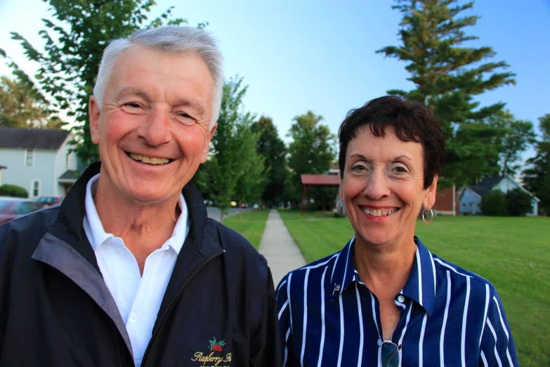 an old man and an old woman are posing for a po