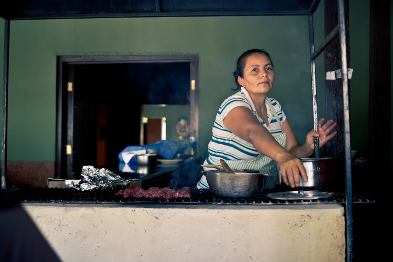 the woman prepares her meal in the kitchen