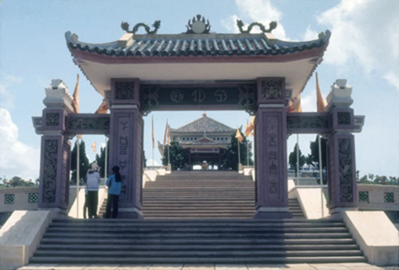 a couple standing under a covered walkway