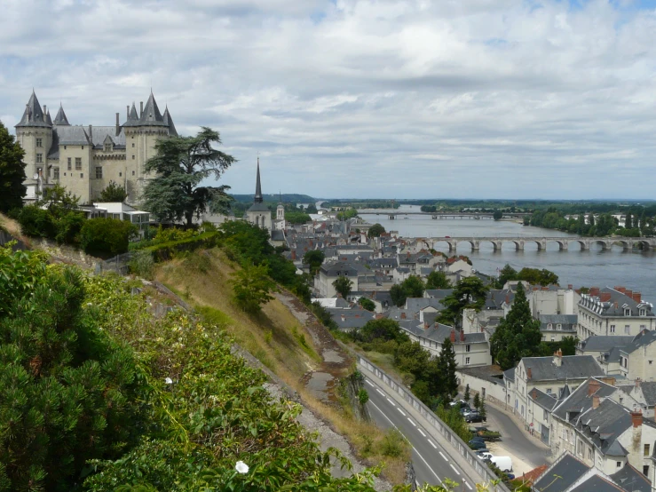 a city along the river with an old bridge