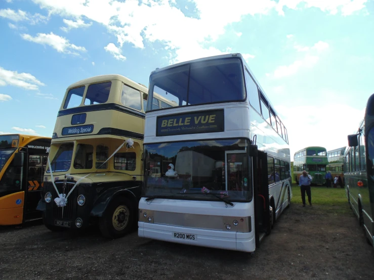 four double decker buses parked in front of each other