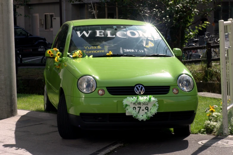 the volkswagen is decorated for a small ceremony
