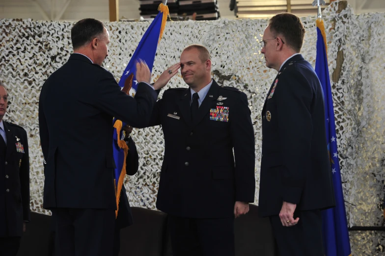 a man in a military uniform  the ceremonial ribbon