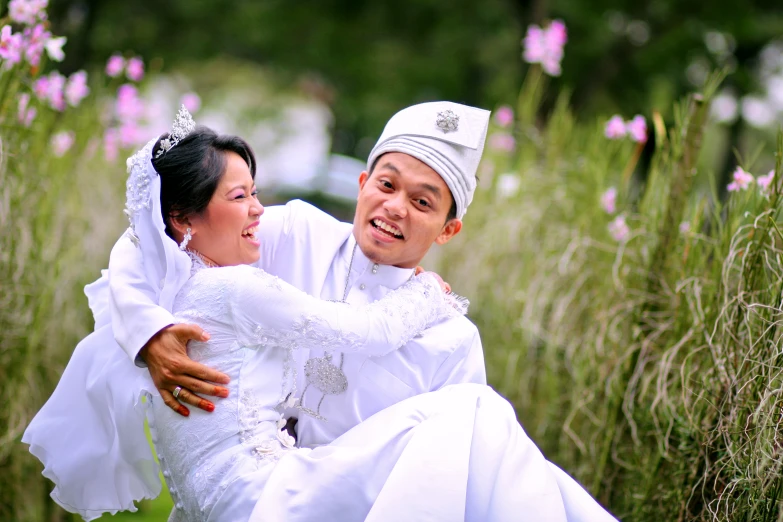 a man holds a bride and she is posing