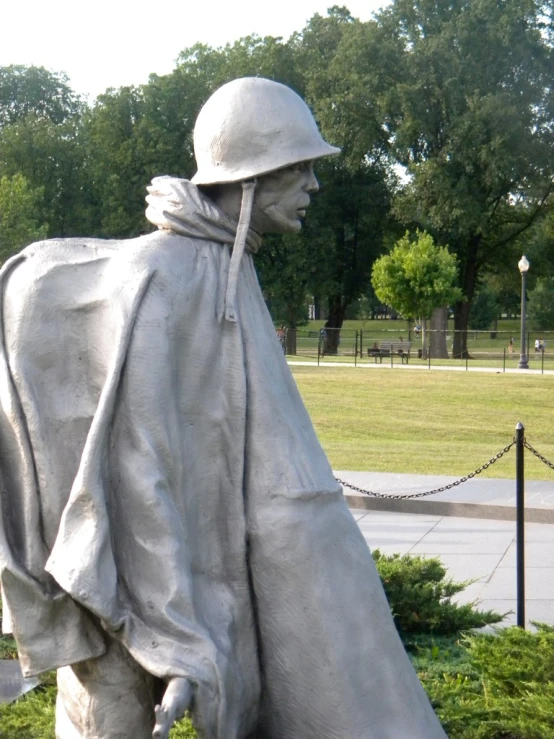 a statue is dressed in a cloth and with a hood on