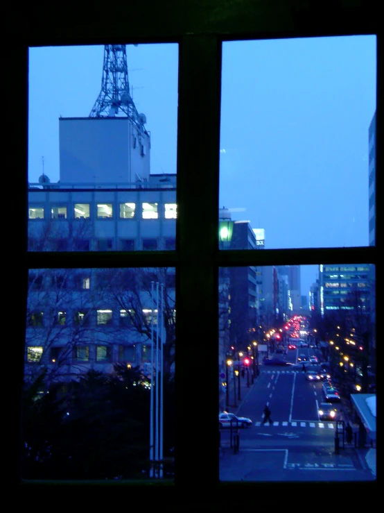 a view from an apartment window looking out on the city