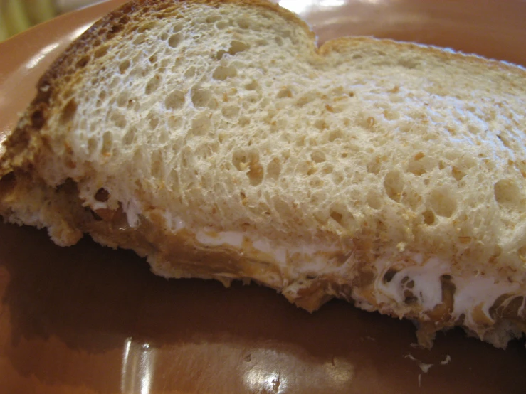 this piece of bread has some cream on it