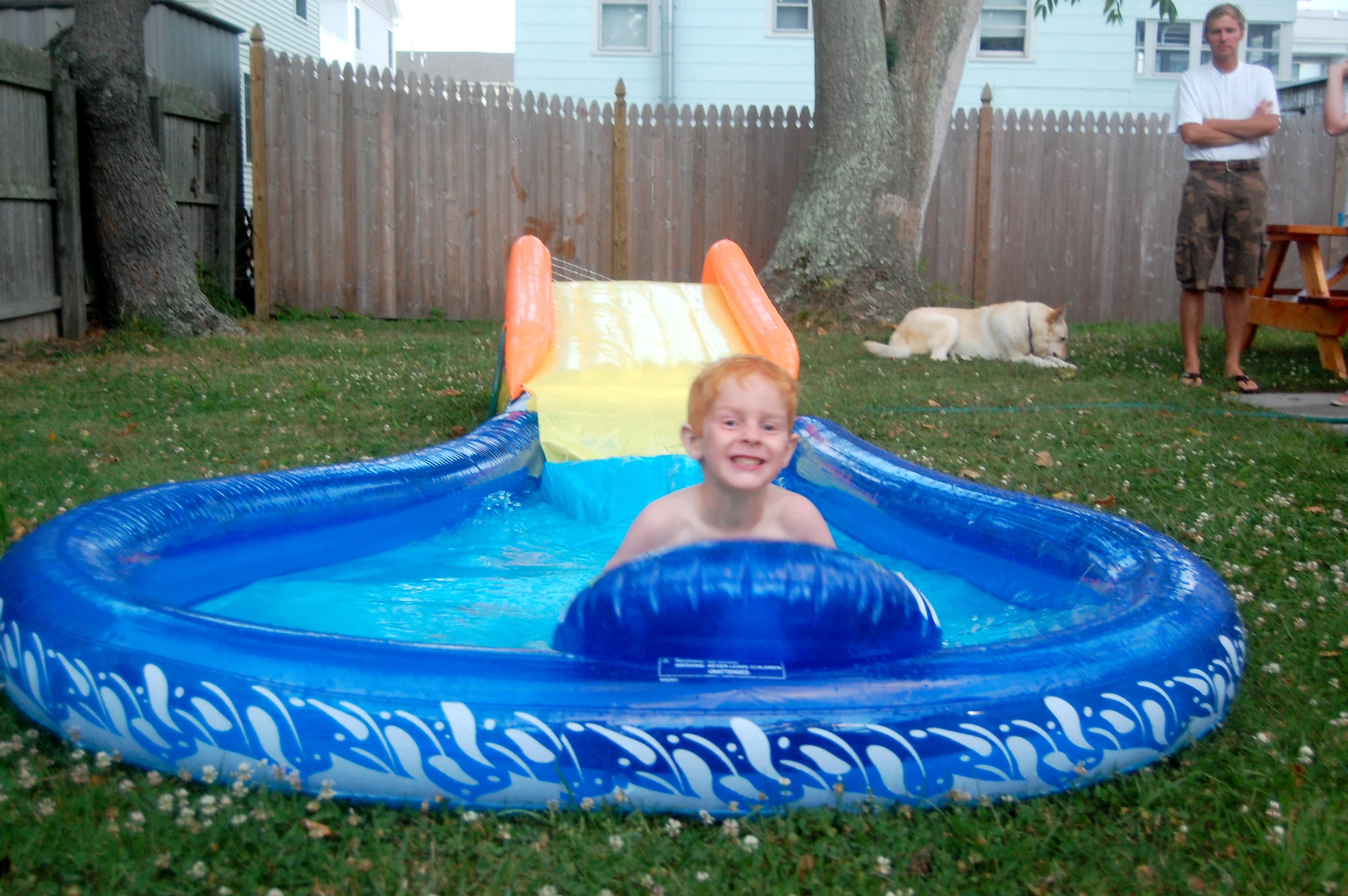 the boy has jumped off the inflatable pool