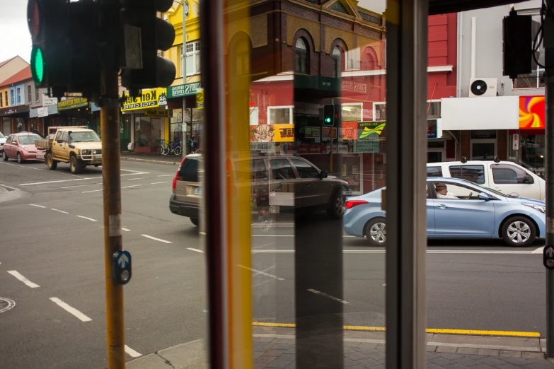 a busy intersection in a small town on an overcast day