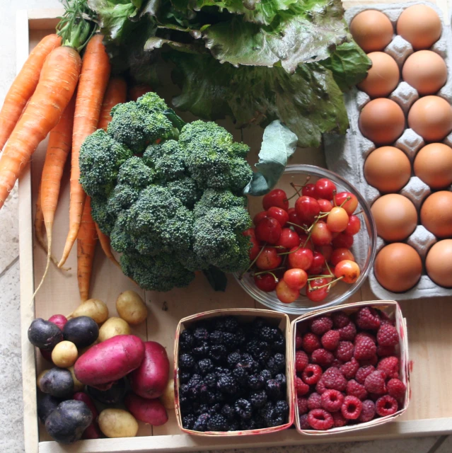 a tray full of assorted fruits and vegetables