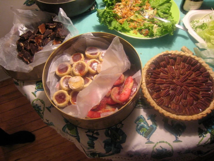 many different fruits and vegetables displayed on a table