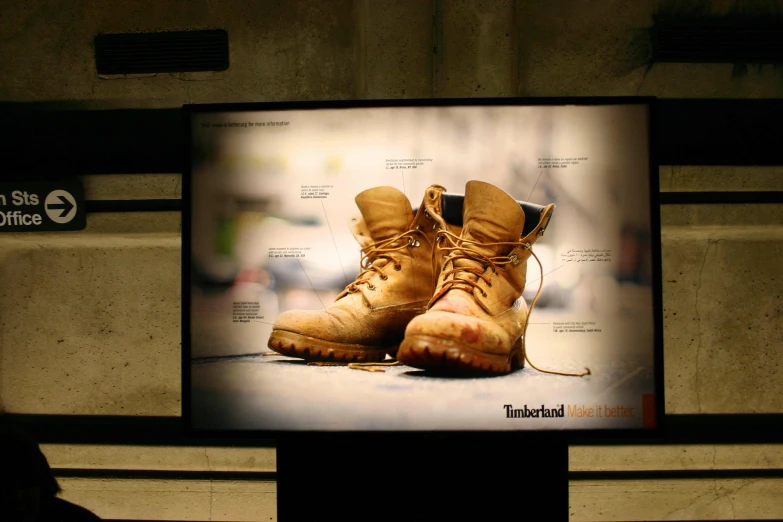 a tv is displayed with a pair of hiking boots