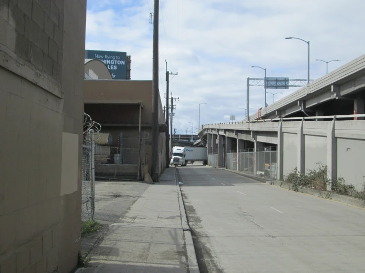 a van is parked in the alley between two buildings