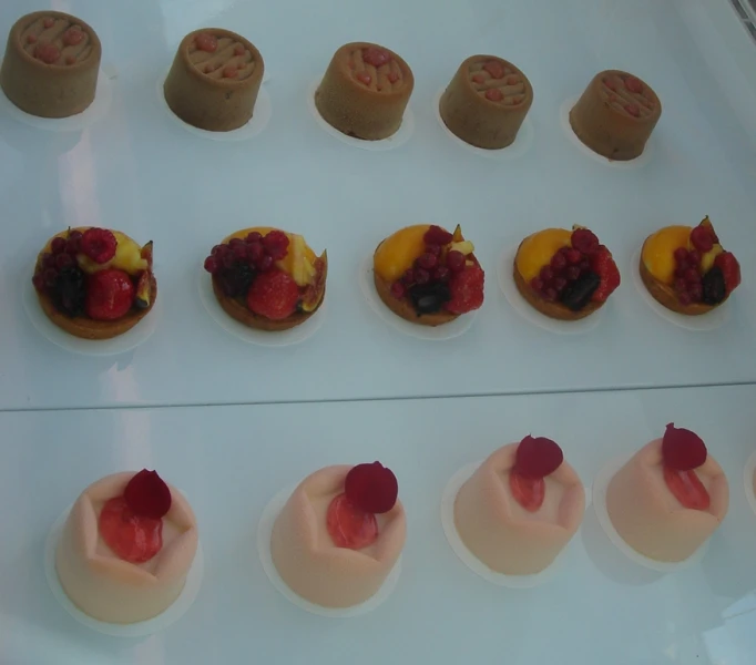 a close up of different kinds of pastry on display