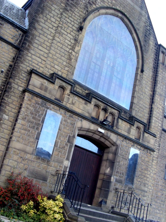 a large building with three windows on top