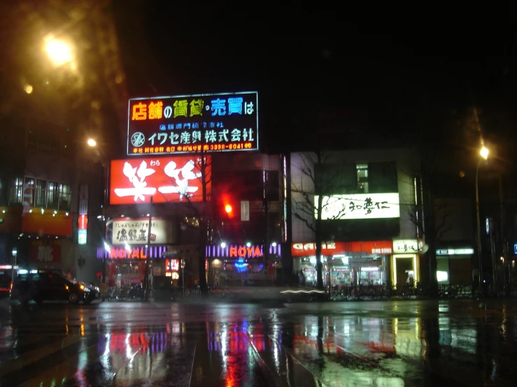 a rainy evening in an asian city at night