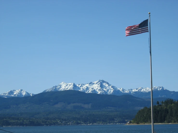 a flag flying next to an american flag