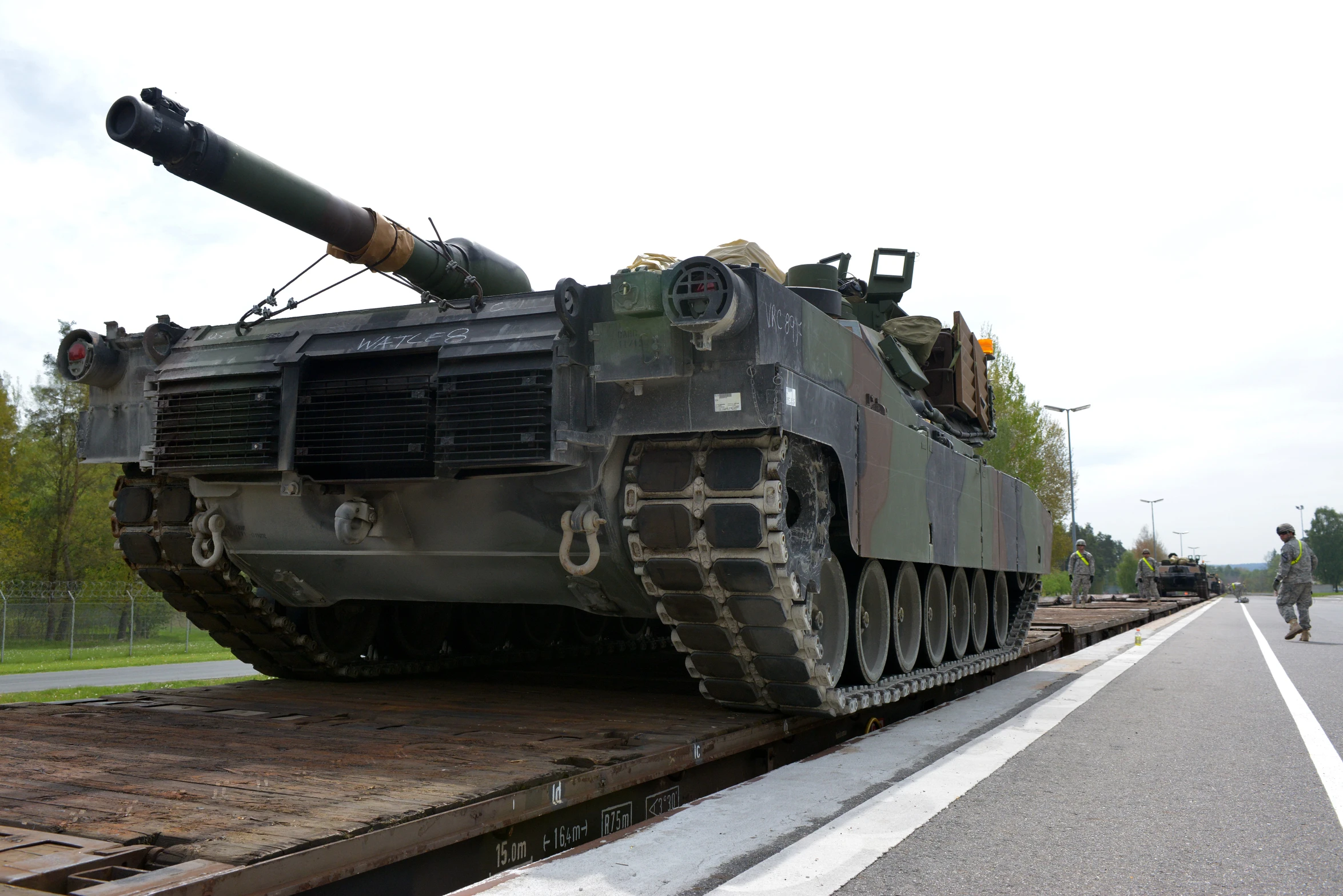 the armored tank is parked on the side of the road