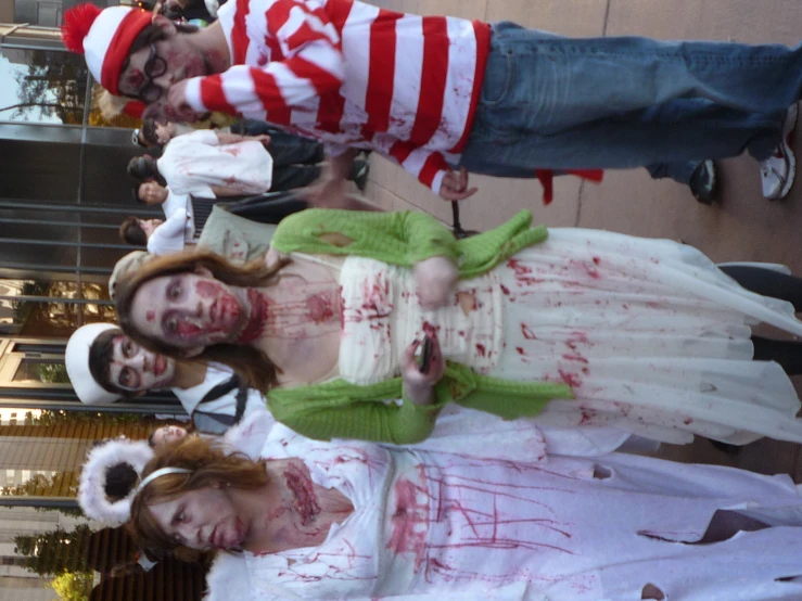 some zombies are wearing costumes in a parade