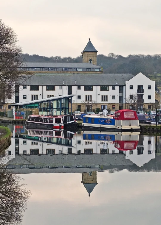 several boats are moored outside a marina