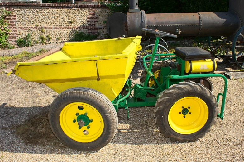 this yellow vehicle has been used as a planter for corn