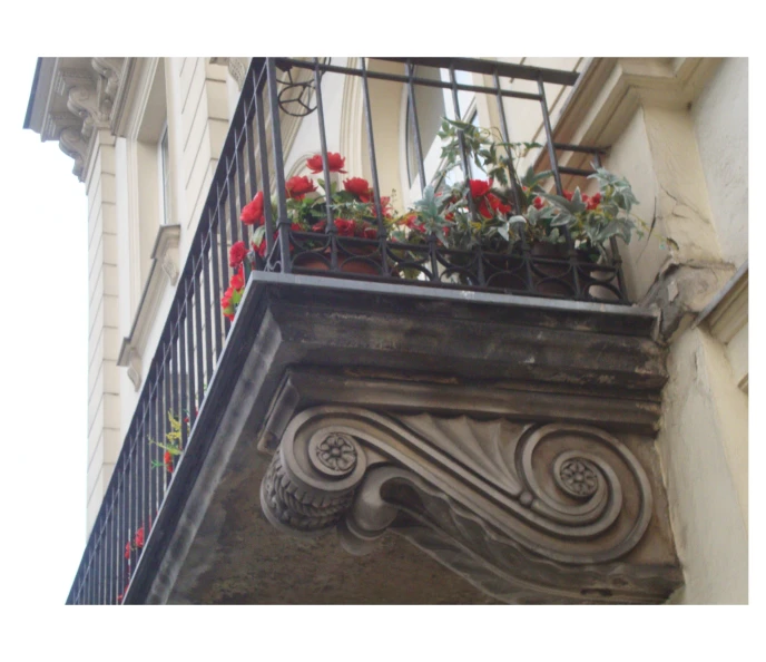 an ornamental balcony with a planter in it