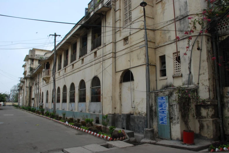 old buildings with potted plants and windows along the street