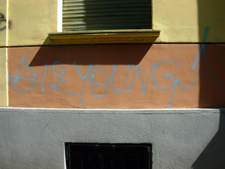 graffiti that says goodbye on the side of a building