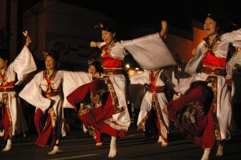 dancers performing in traditional costumes and headpieces