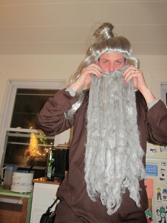 a man with long hair wearing a viking costume