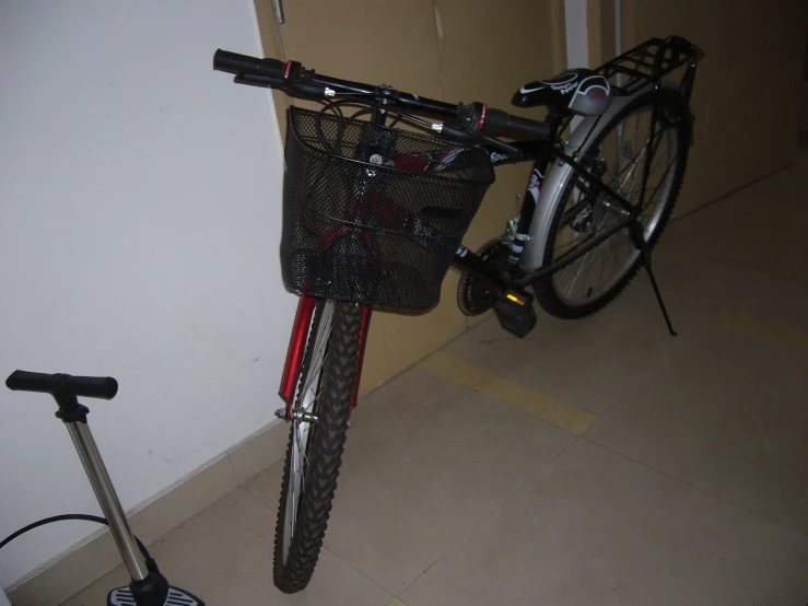 a bicycle parked next to a door in a room