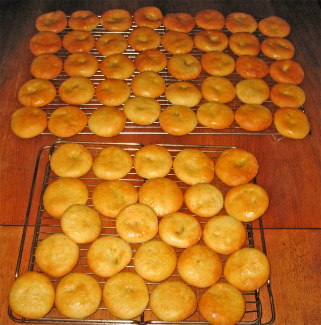 several baskets filled with donuts sitting on top of metal racks