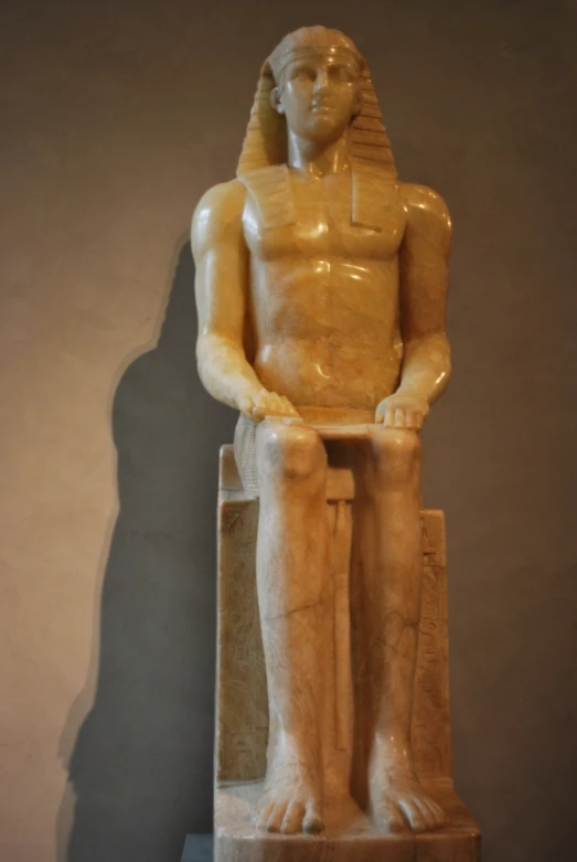 a sculpture of a man with a pharaoh face