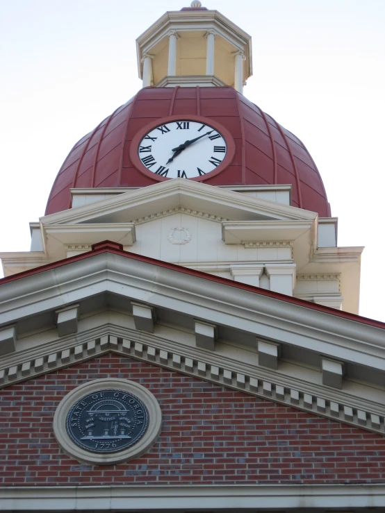 there is a clock that reads 4 35 as it stands above the dome